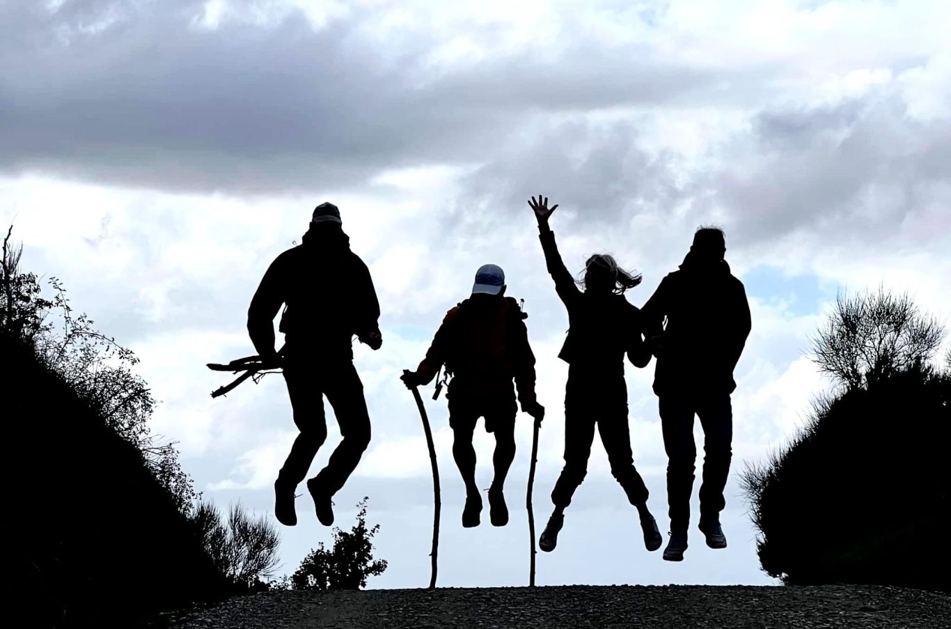 Four people jumping